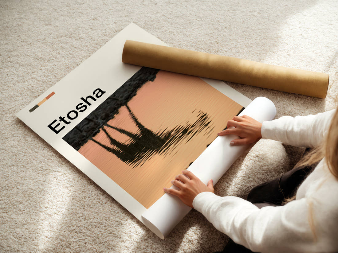 Etosha Giraffe Reflection Travel Print being unrolled from its postal tube