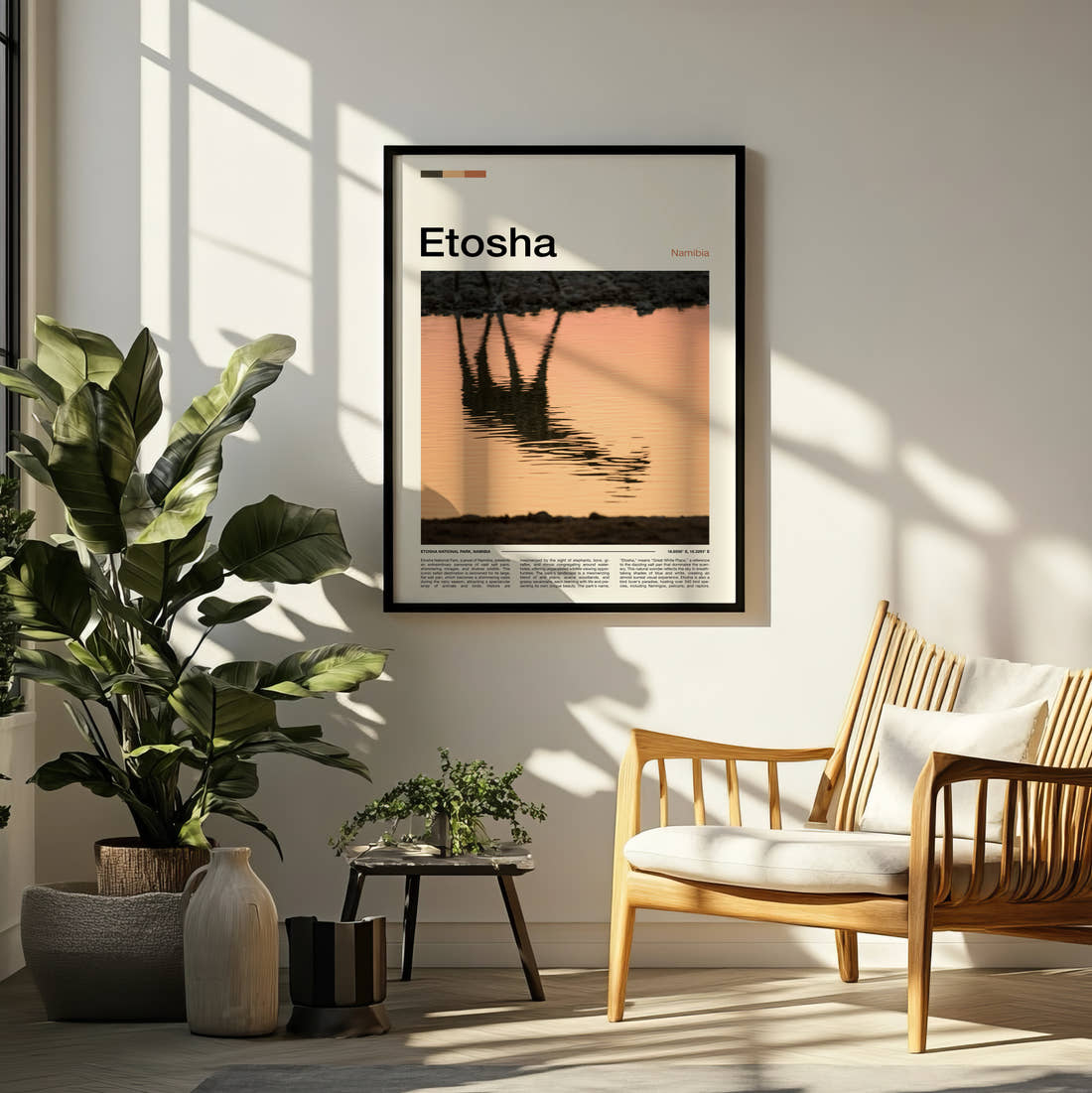 Etosha Giraffe Reflection Travel Print framed on a pale wall beside houseplants