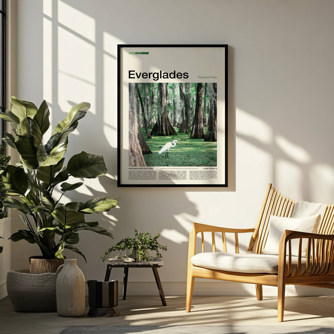 Everglades White Egret Travel Print framed on a pale wall beside houseplants