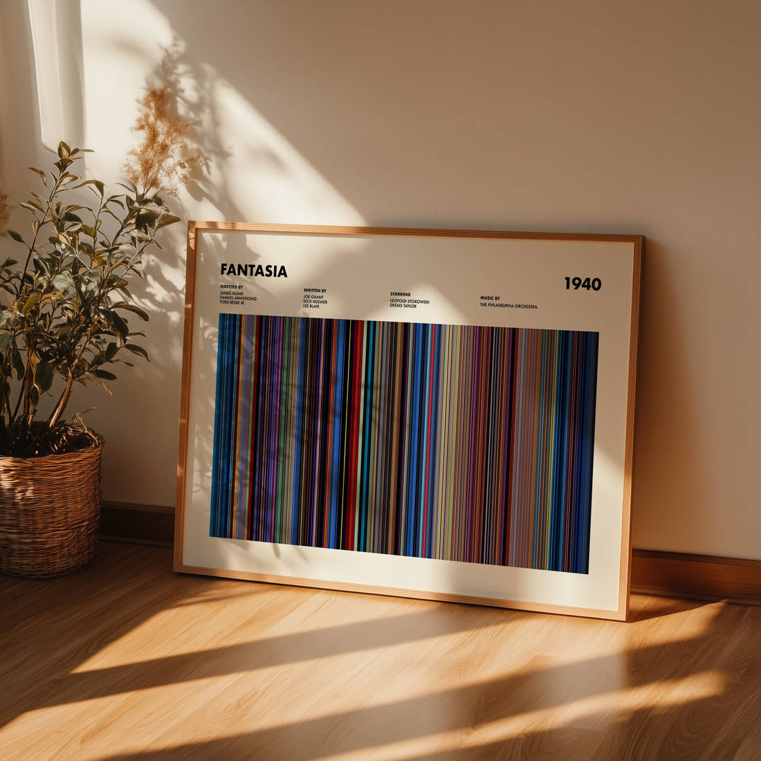 Fantasia Movie Barcode Poster framed and leaning against a wall on a wooden floor