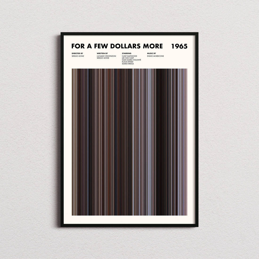 For a Few Dollars More Movie Barcode Poster framed on a plain studio wall