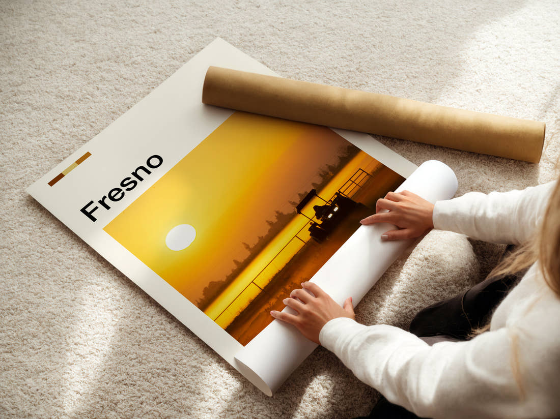 Fresno Tractor At Sunset Travel Print being unrolled from its postal tube