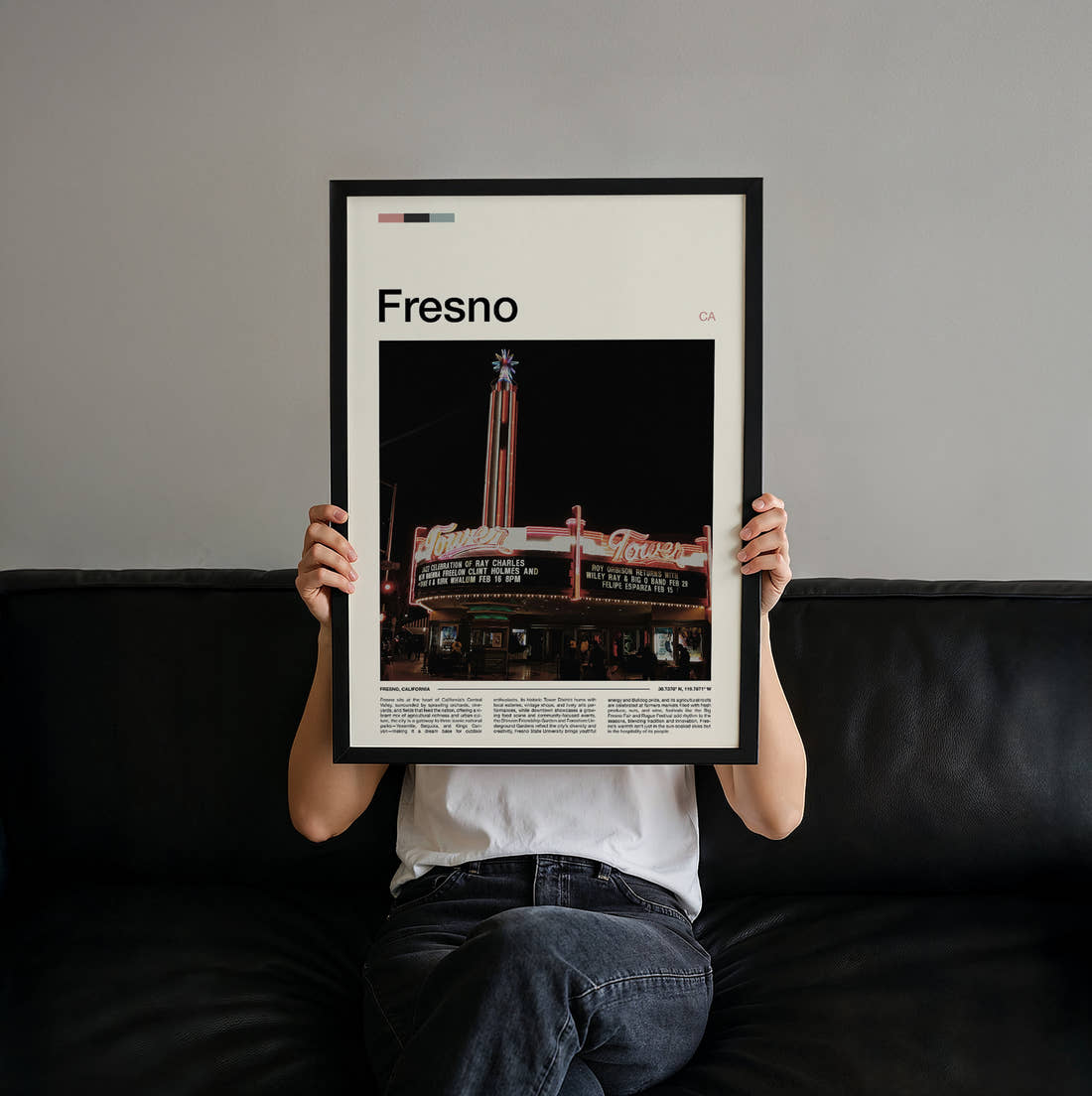 Fresno Tower Theatre Travel Print held up by hand to show the size of the print