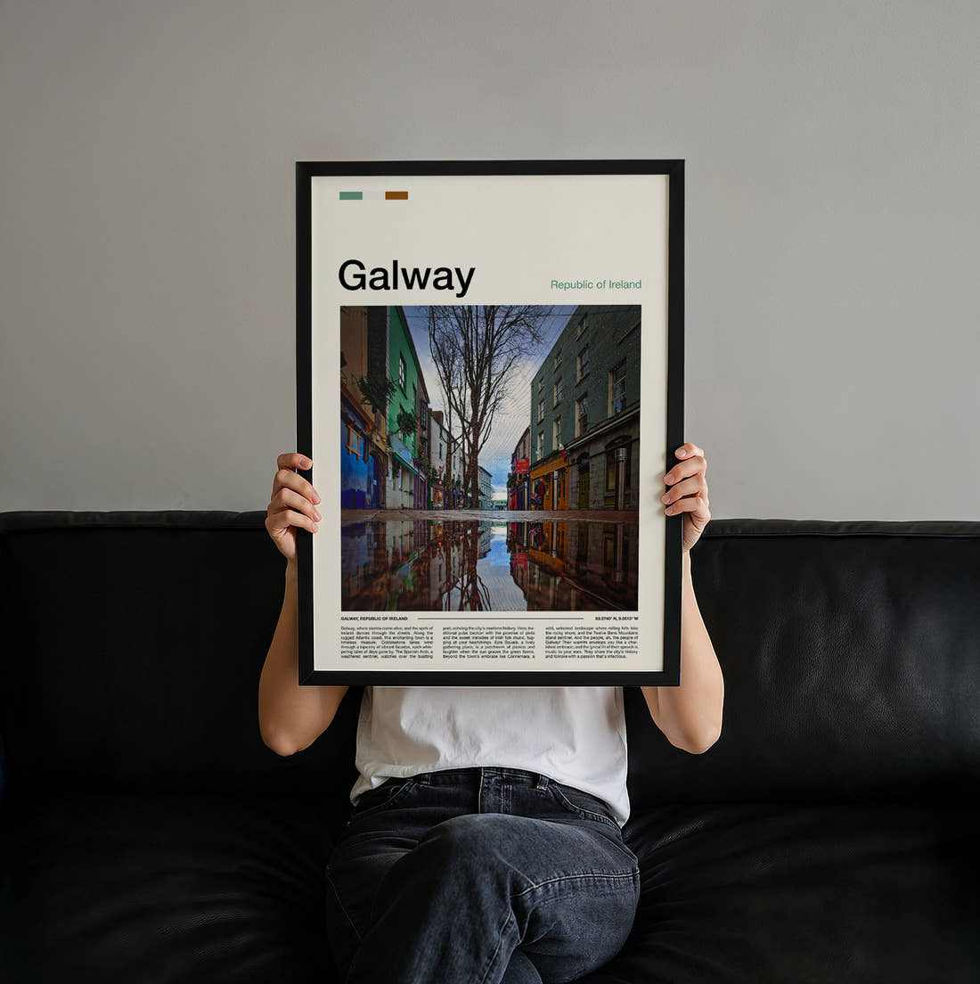 Galway Reflections In A Puddle Travel Print held up by hand to show the size of the print