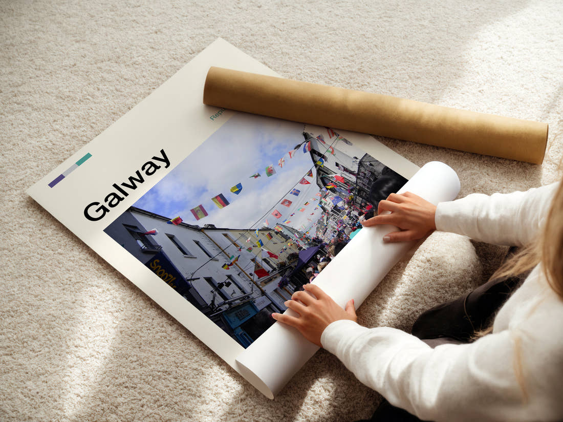 Galway Street With Bunting Travel Print being unrolled from its postal tube