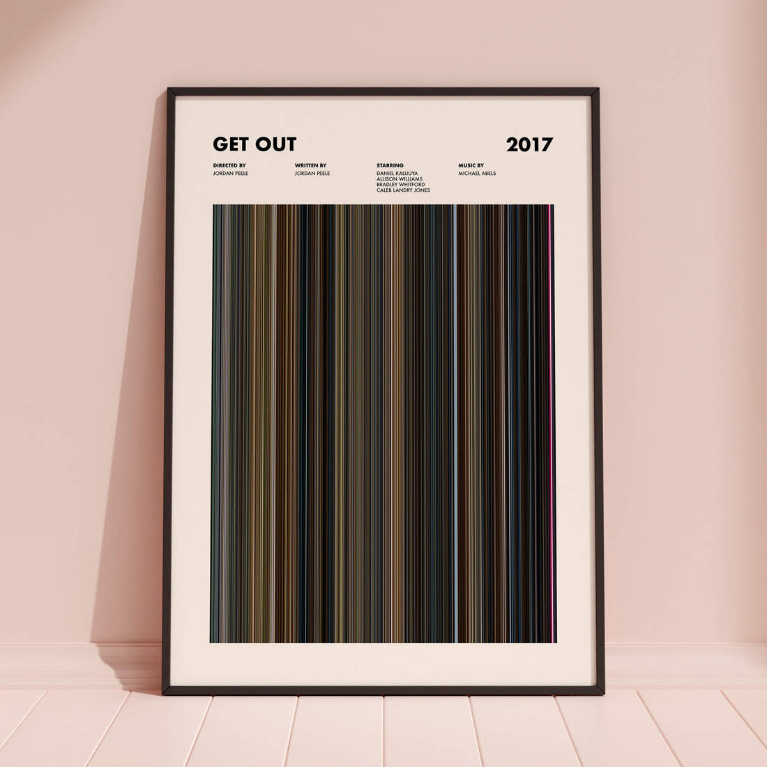 Get Out Movie Barcode Poster framed and leaning against a coloured wall