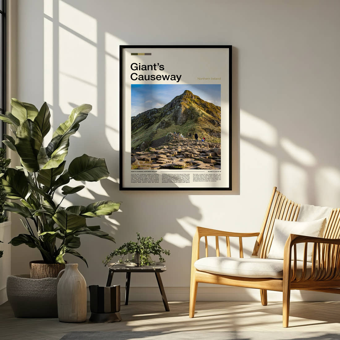 Giant's Causeway Rocky Cliff Path Travel Print framed on a pale wall beside houseplants