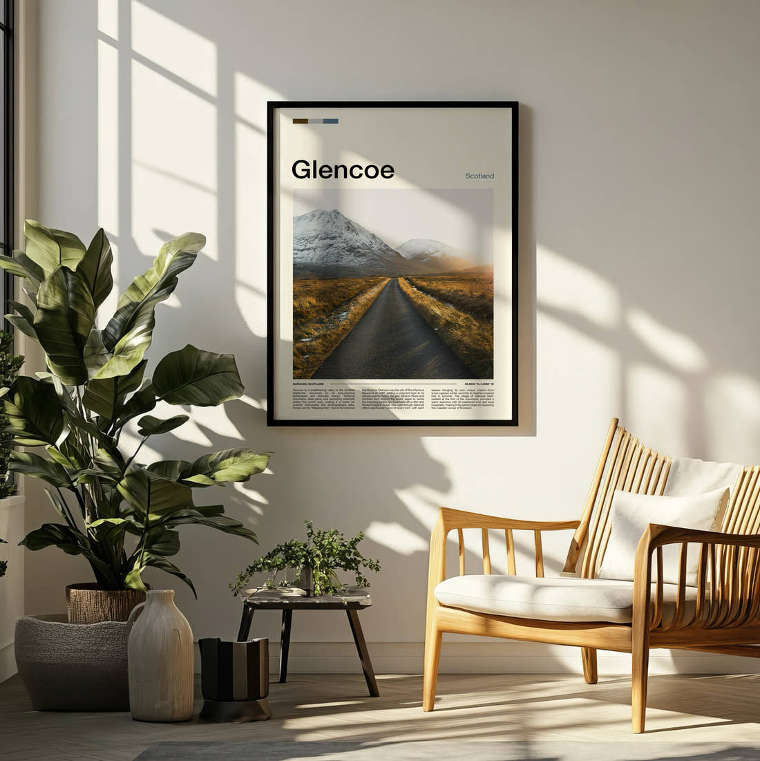 Glencoe Empty Road Through Mountains Travel Print framed on a pale wall beside houseplants