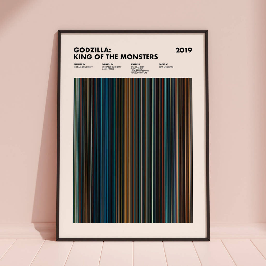 Godzilla King of the Monsters Movie Barcode Poster framed and leaning against a coloured wall