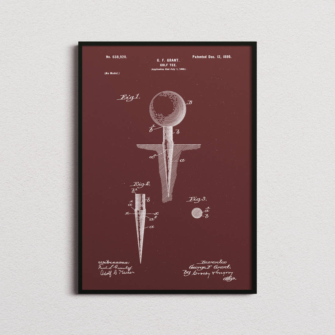 Golf Tee Patent Print in the burgundy colourway, framed