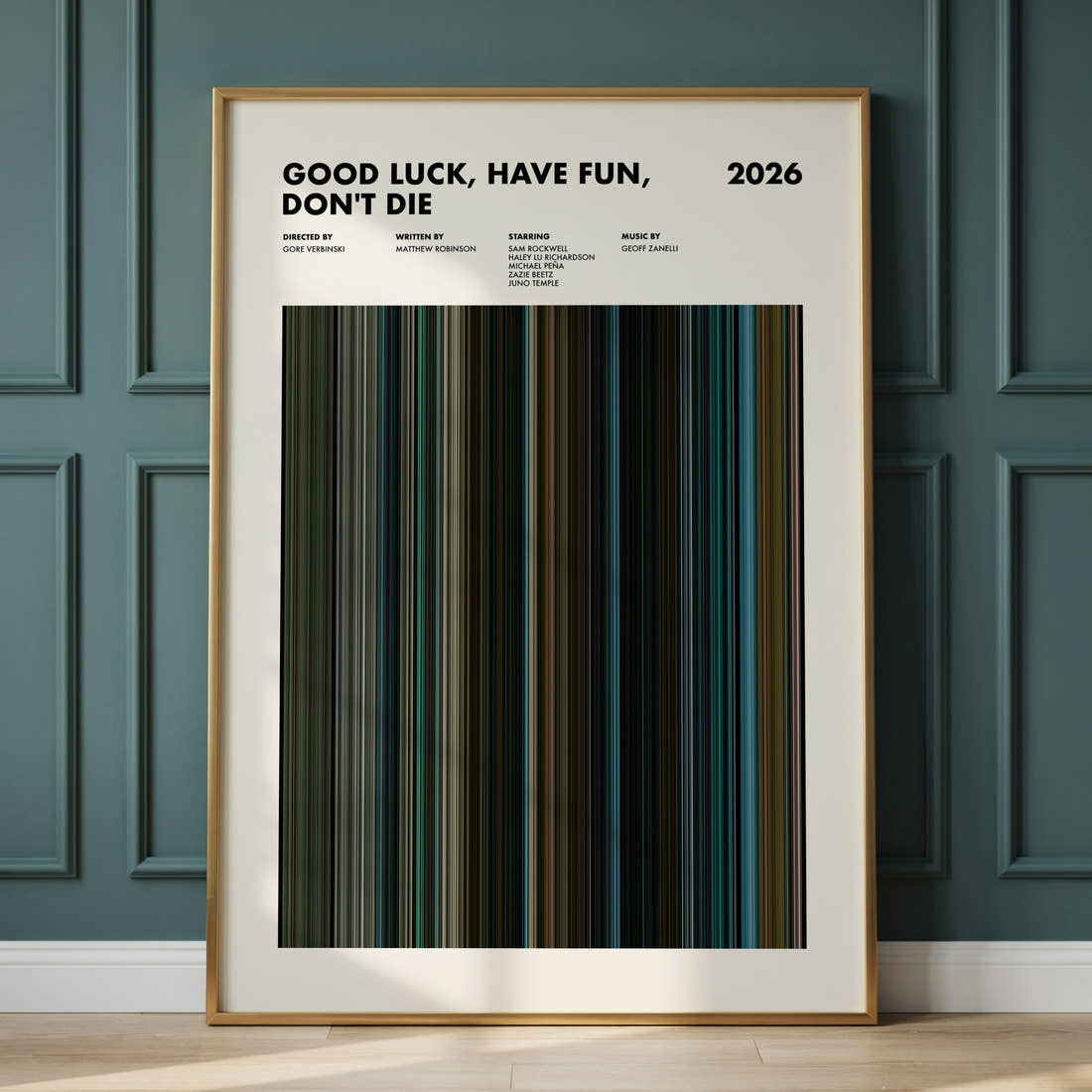 Good Luck, Have Fun, Don't Die Movie Barcode Poster framed and leaning against a panelled wall