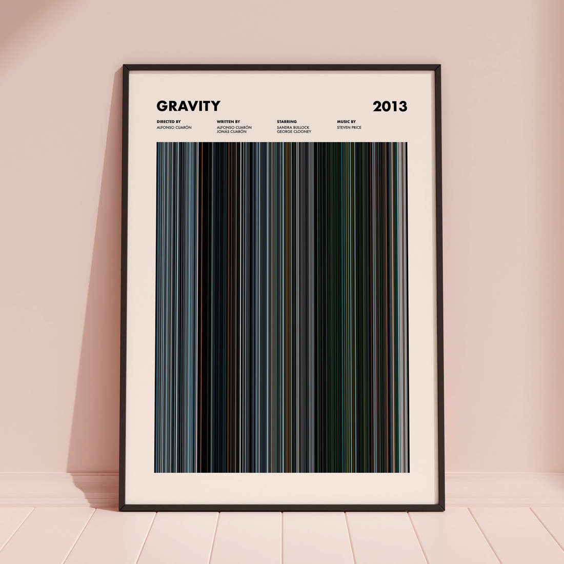 Gravity Movie Barcode Poster framed and leaning against a coloured wall