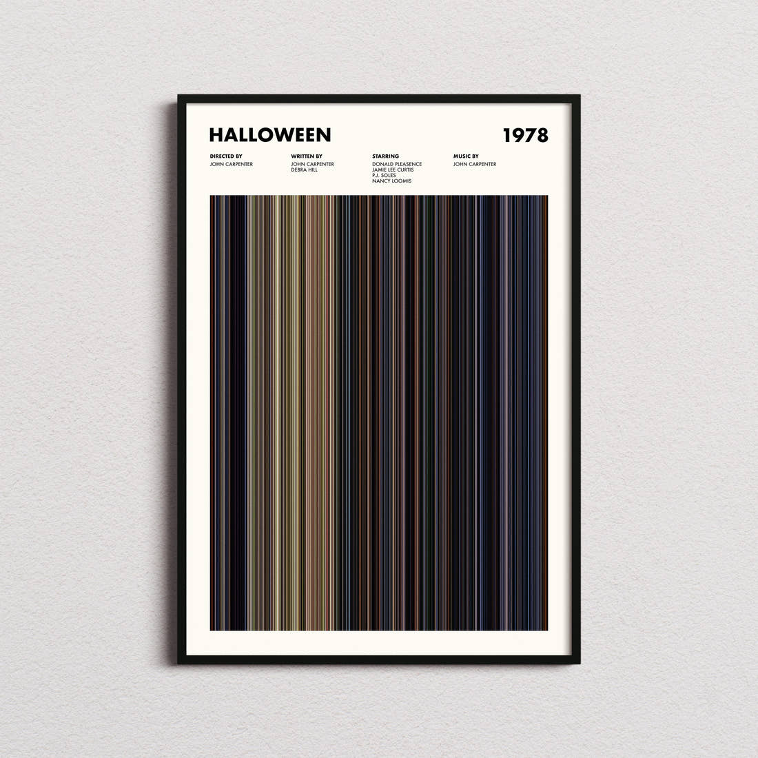 Halloween Movie Barcode Poster framed on a plain studio wall