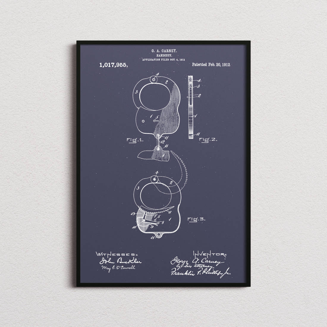 Handcuffs Patent Print in the navy colourway, framed