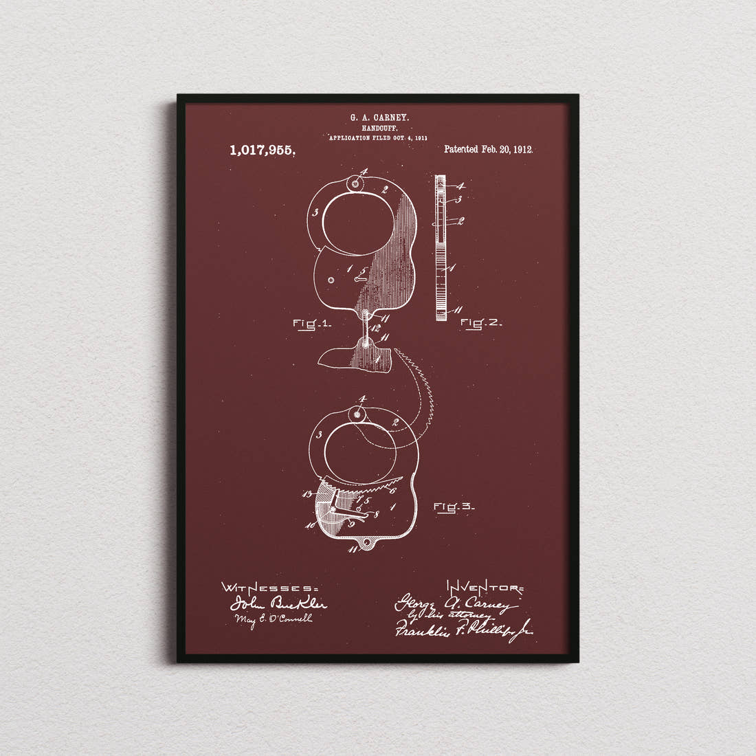 Handcuffs Patent Print in the burgundy colourway, framed