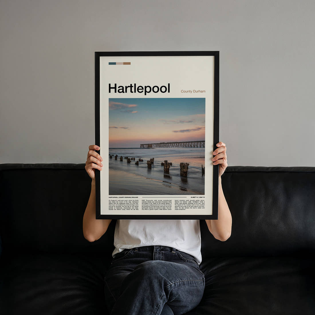 Hartlepool Pier At Dusk Travel Print held up by hand to show the size of the print