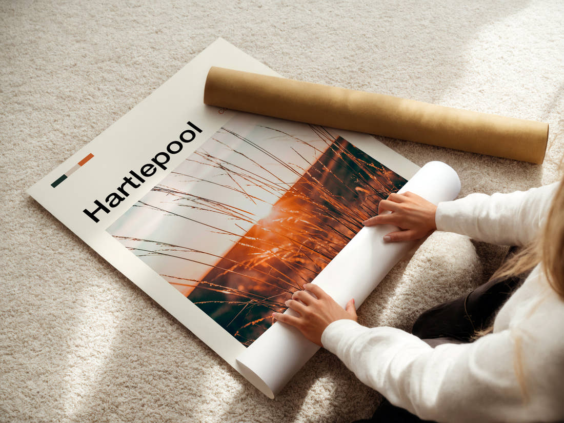 Hartlepool Golden Grass Sunset Travel Print being unrolled from its postal tube