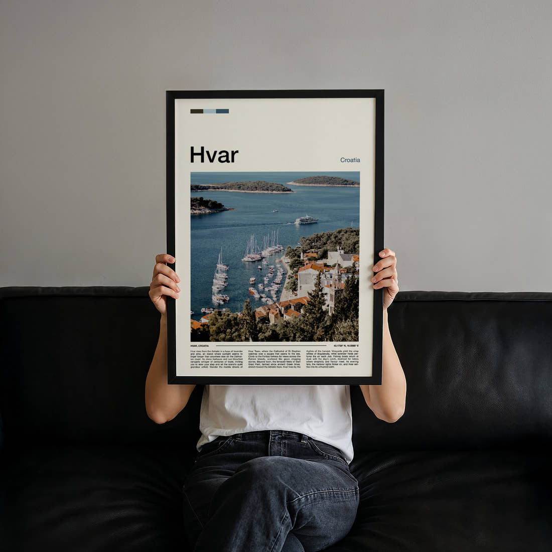 Hvar Harbour From Above Travel Print held up by hand to show the size of the print