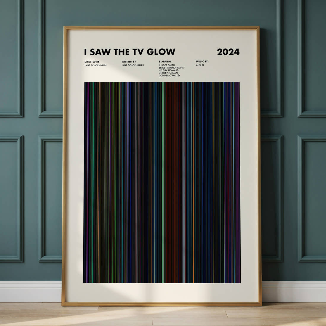 I Saw the TV Glow Movie Barcode Poster framed and leaning against a panelled wall