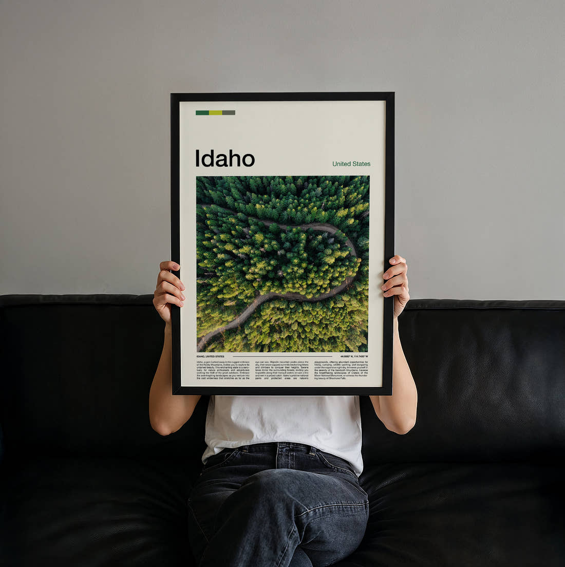 Idaho Winding Road Through Forest Travel Print held up by hand to show the size of the print