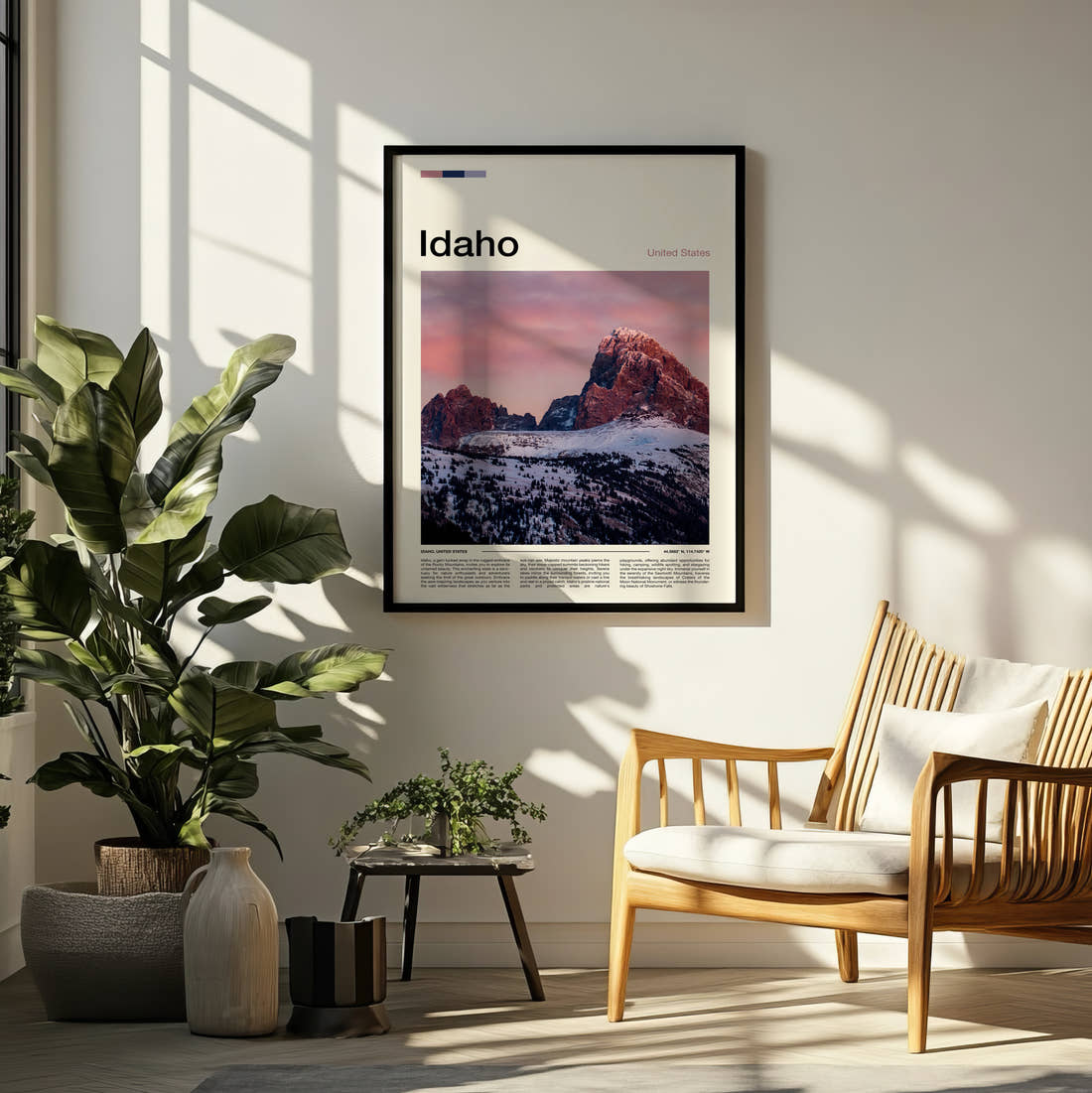 Idaho Pink Dawn Over Peaks Travel Print framed on a pale wall beside houseplants