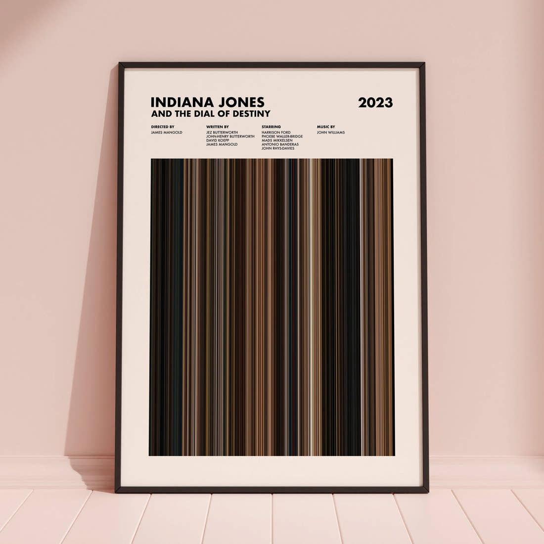 Indiana Jones and the Dial of Destiny Movie Barcode Poster framed and leaning against a coloured wall