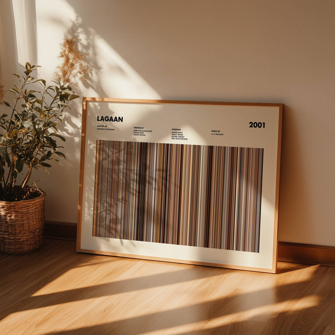 Lagaan Movie Barcode Poster framed and leaning against a wall on a wooden floor