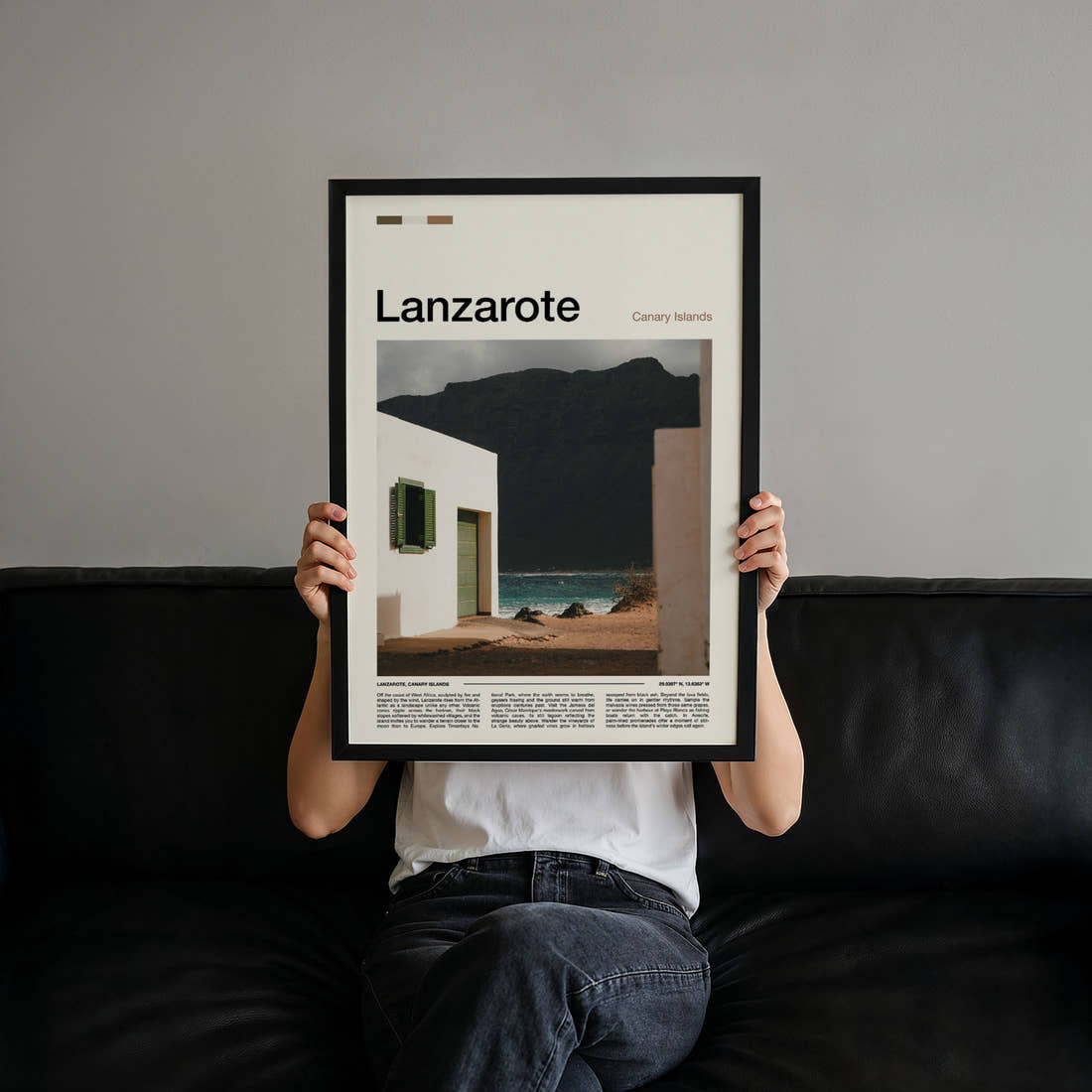 Lanzarote Whitewashed House, Volcanic Cliff Travel Print held up by hand to show the size of the print