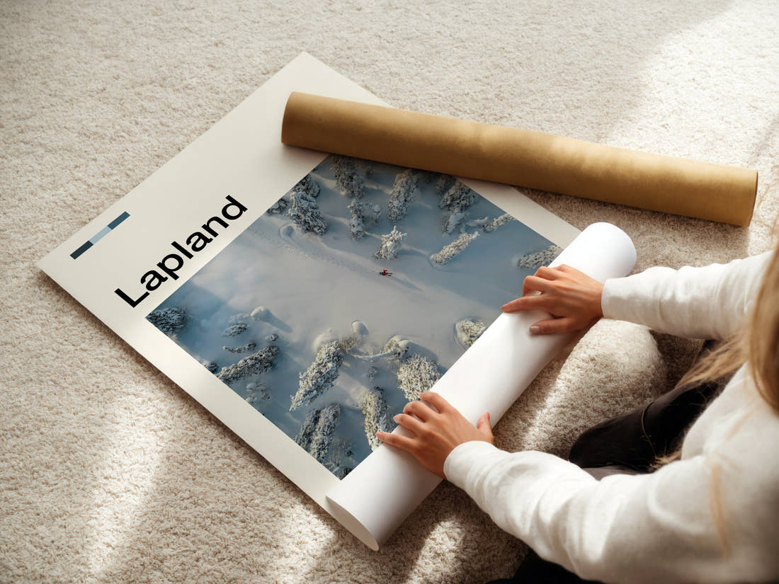 Lapland Aerial Snow Forest Travel Print being unrolled from its postal tube