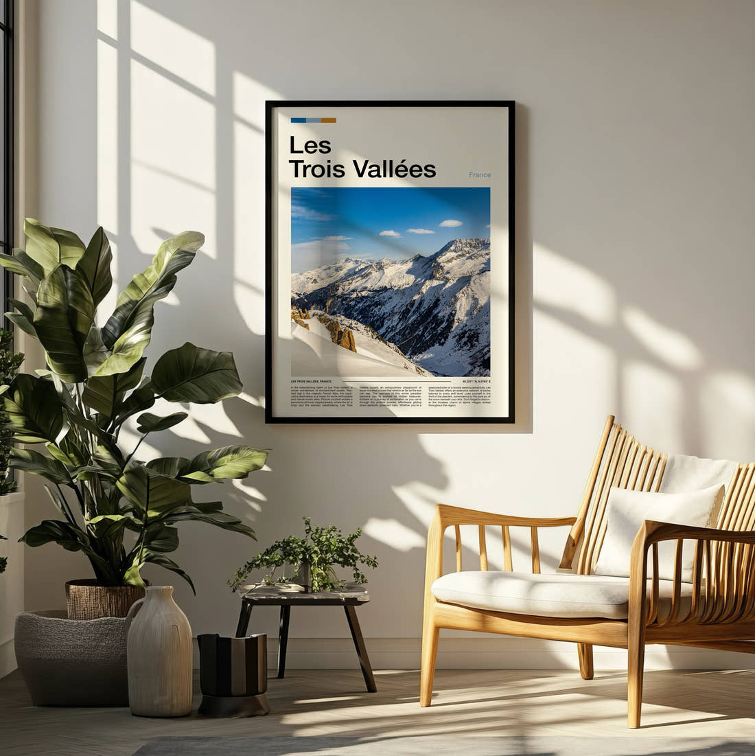 Les Trois Vallees Snowy Mountain Peaks Travel Print framed on a pale wall beside houseplants