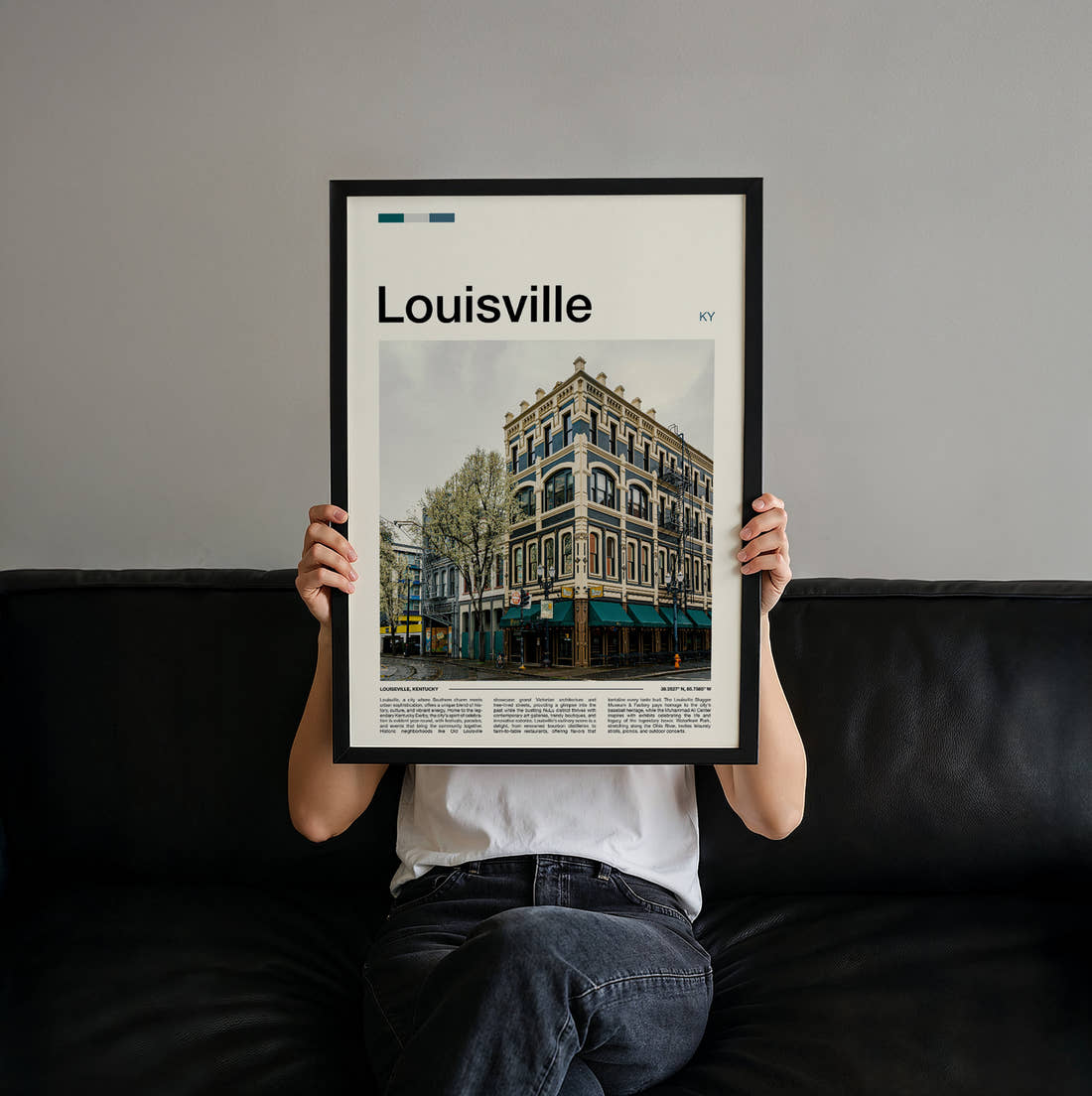 Louisville Ornate Cast Iron Building Travel Print held up by hand to show the size of the print