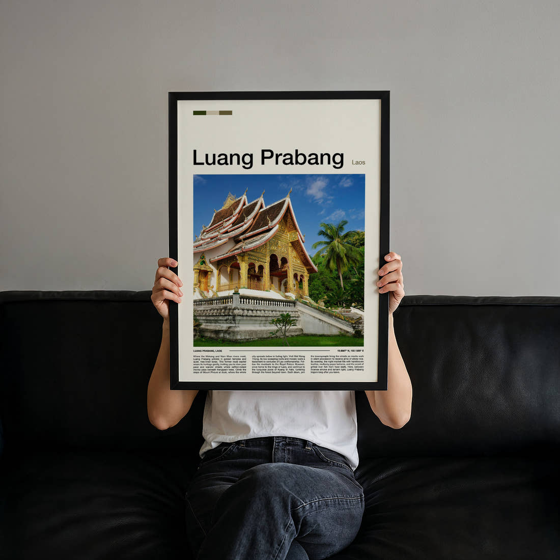 Luang Prabang Golden Temple Facade Travel Print held up by hand to show the size of the print