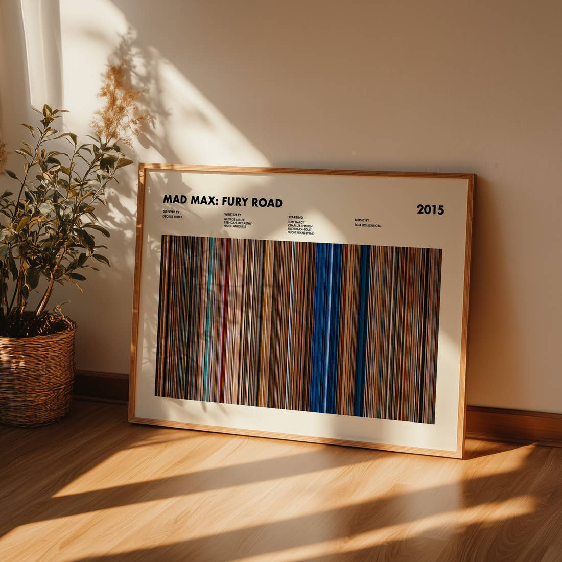 Mad Max: Fury Road Movie Barcode Poster framed and leaning against a wall on a wooden floor