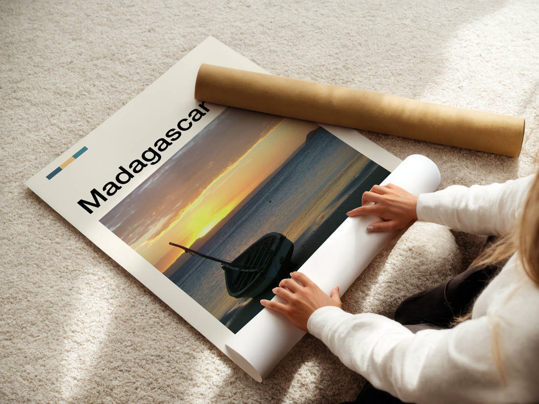 Madagascar Boat At Sunset Travel Print being unrolled from its postal tube