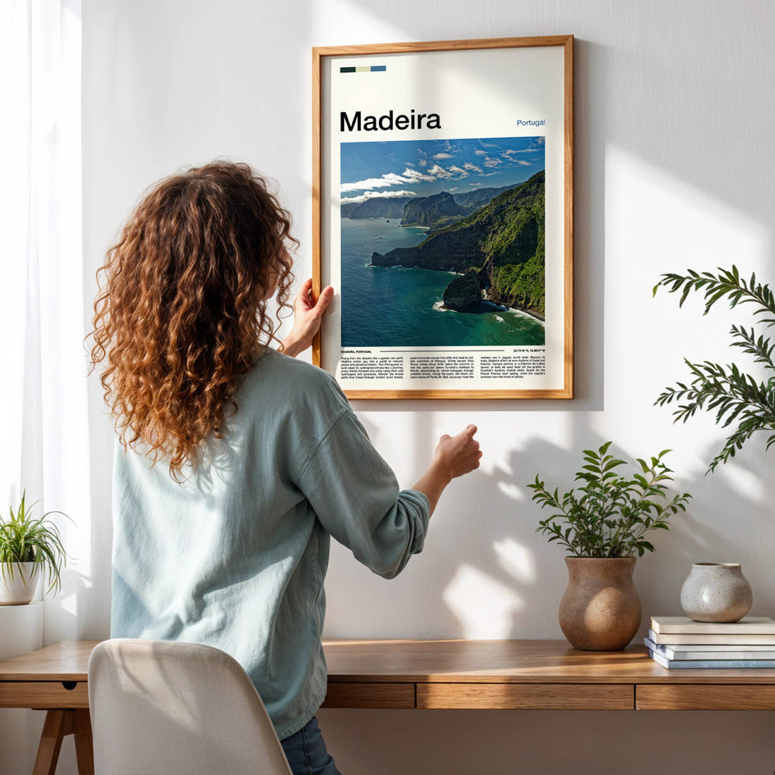Madeira Volcanic Coastal Cliffs Travel Print framed on a pale wall beside houseplants