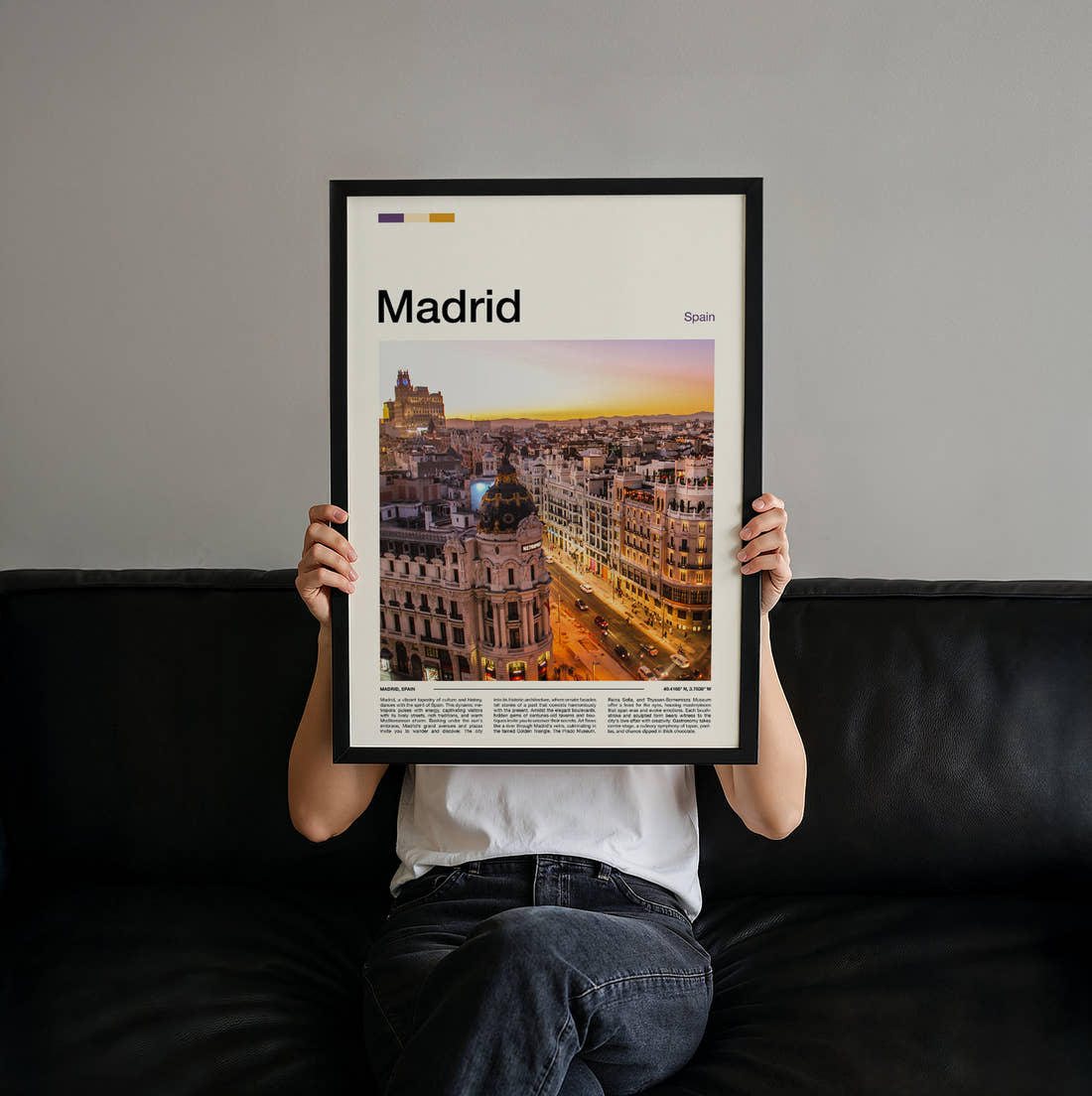 Madrid Metropolis Building At Sunset Travel Print held up by hand to show the size of the print