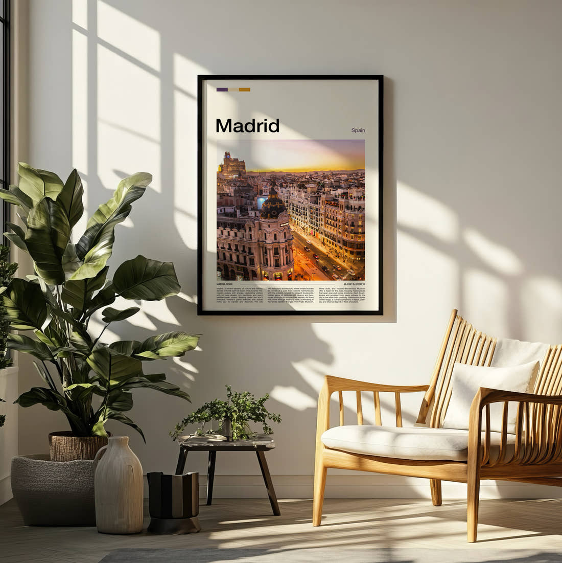Madrid Metropolis Building At Sunset Travel Print framed on a pale wall beside houseplants