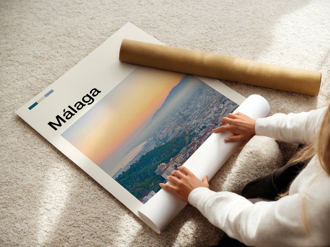 Malaga Hazy City View Travel Print being unrolled from its postal tube