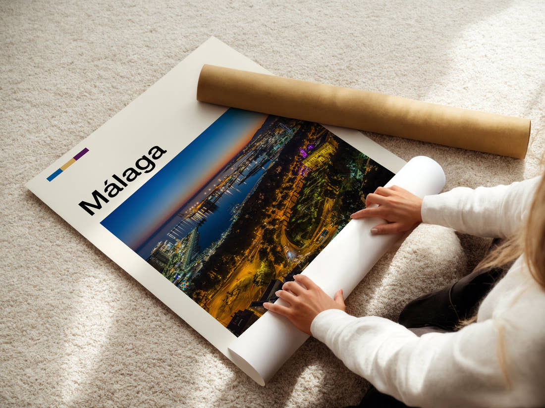 Malaga Port Lights At Night Travel Print being unrolled from its postal tube