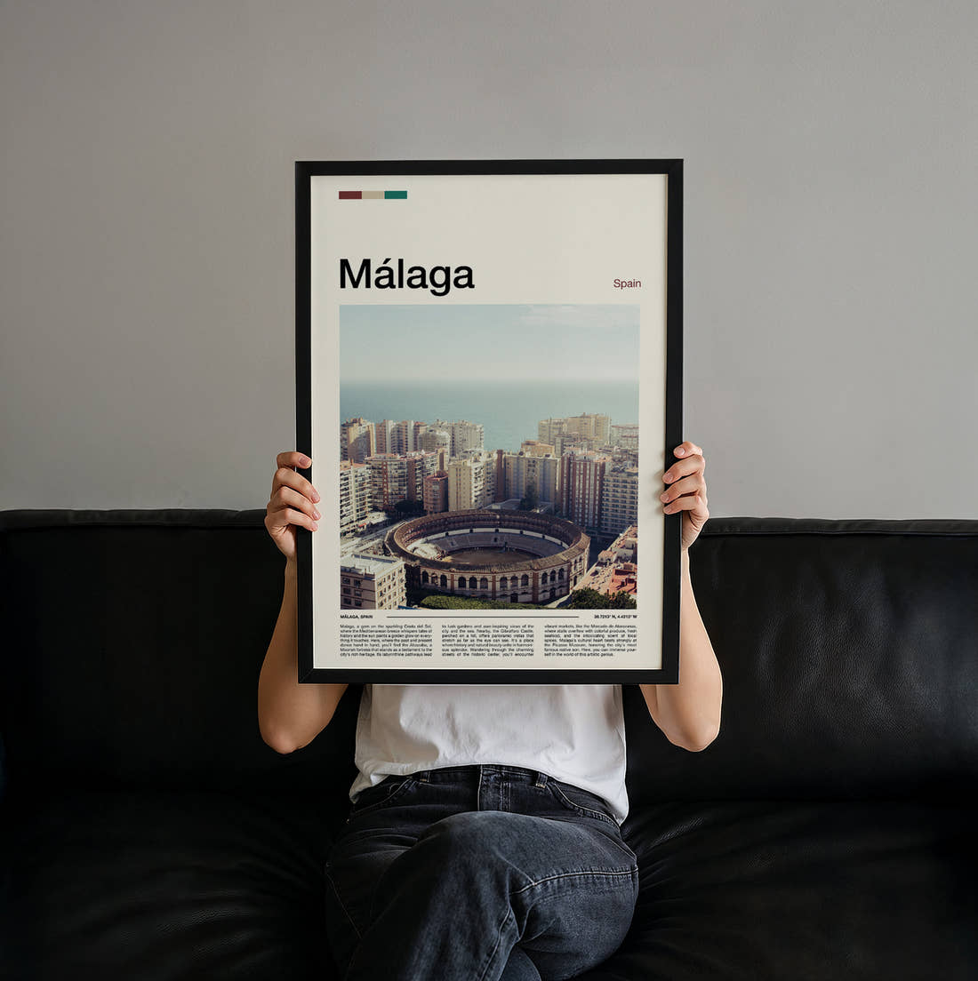 Malaga Bullring From Above Travel Print held up by hand to show the size of the print