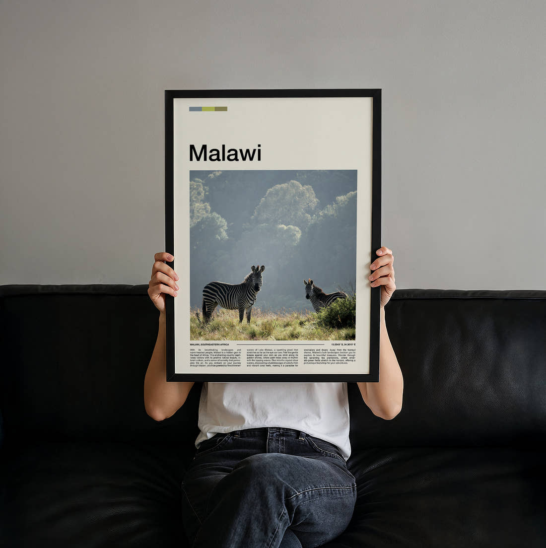 Malawi Zebras Travel Print held up by hand to show the size of the print