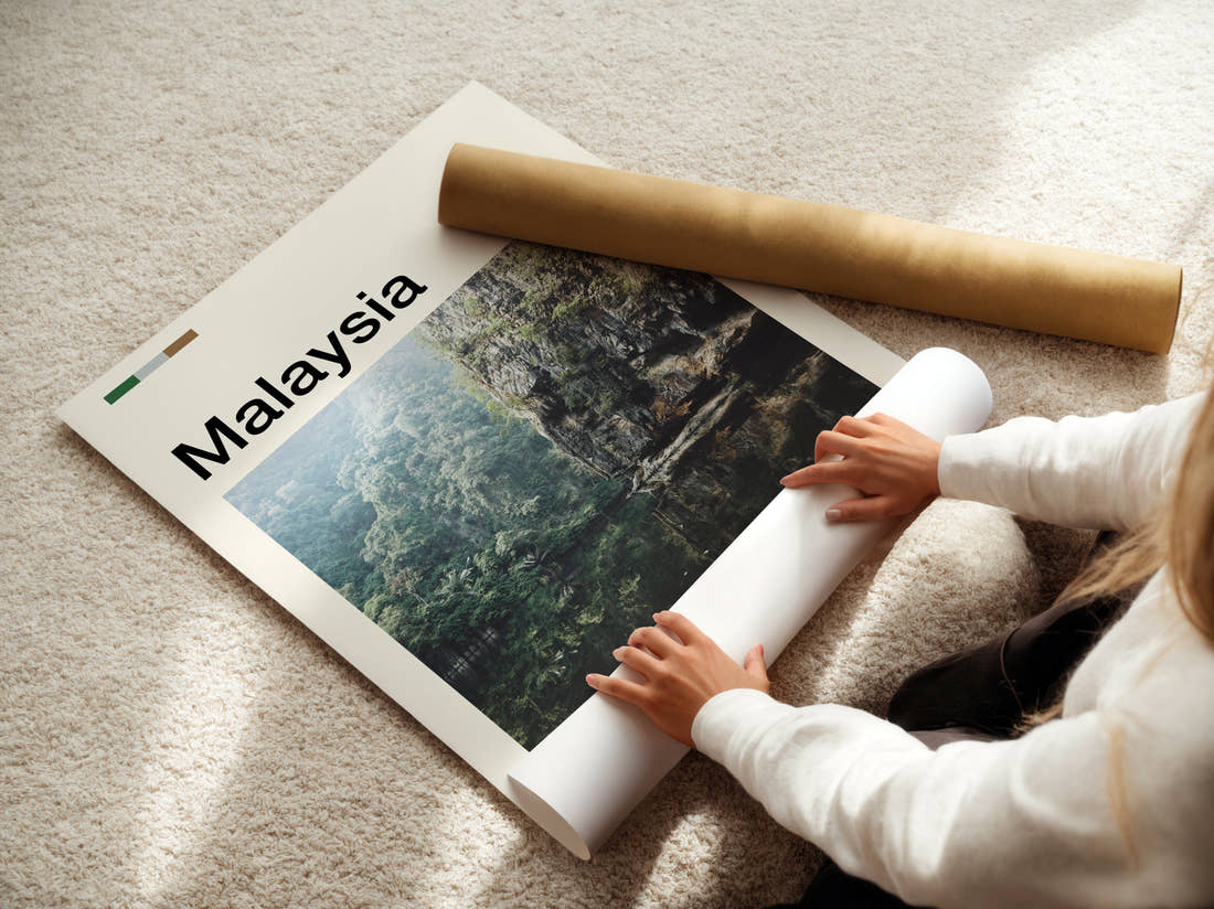 Malaysia Cliffs Reflected In Water Travel Print being unrolled from its postal tube
