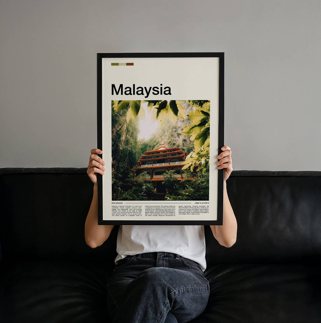 Malaysia Temple In The Jungle Travel Print held up by hand to show the size of the print