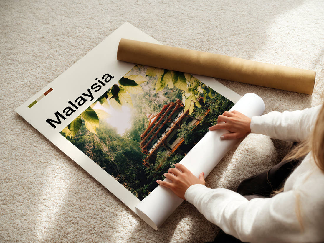 Malaysia Temple In The Jungle Travel Print being unrolled from its postal tube