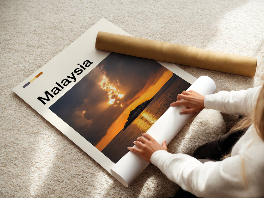Malaysia Sunset Over Small Island Travel Print being unrolled from its postal tube