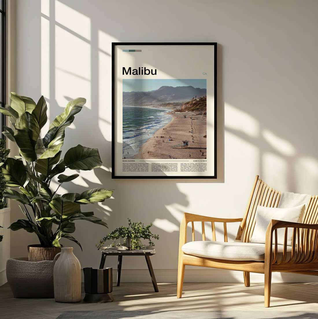 Malibu Beach And Coastal Hills Travel Print framed on a pale wall beside houseplants