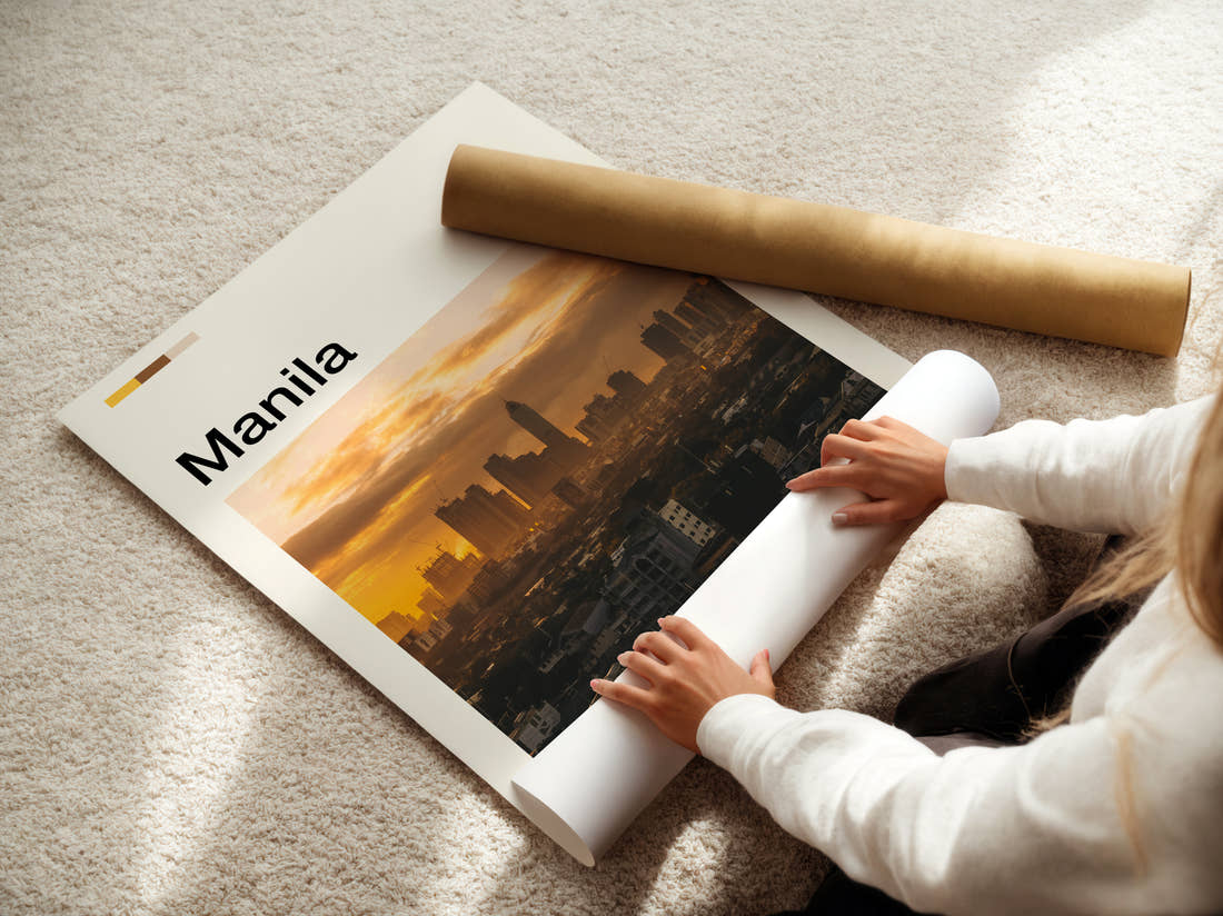 Manila Skyline At Sunset Travel Print being unrolled from its postal tube