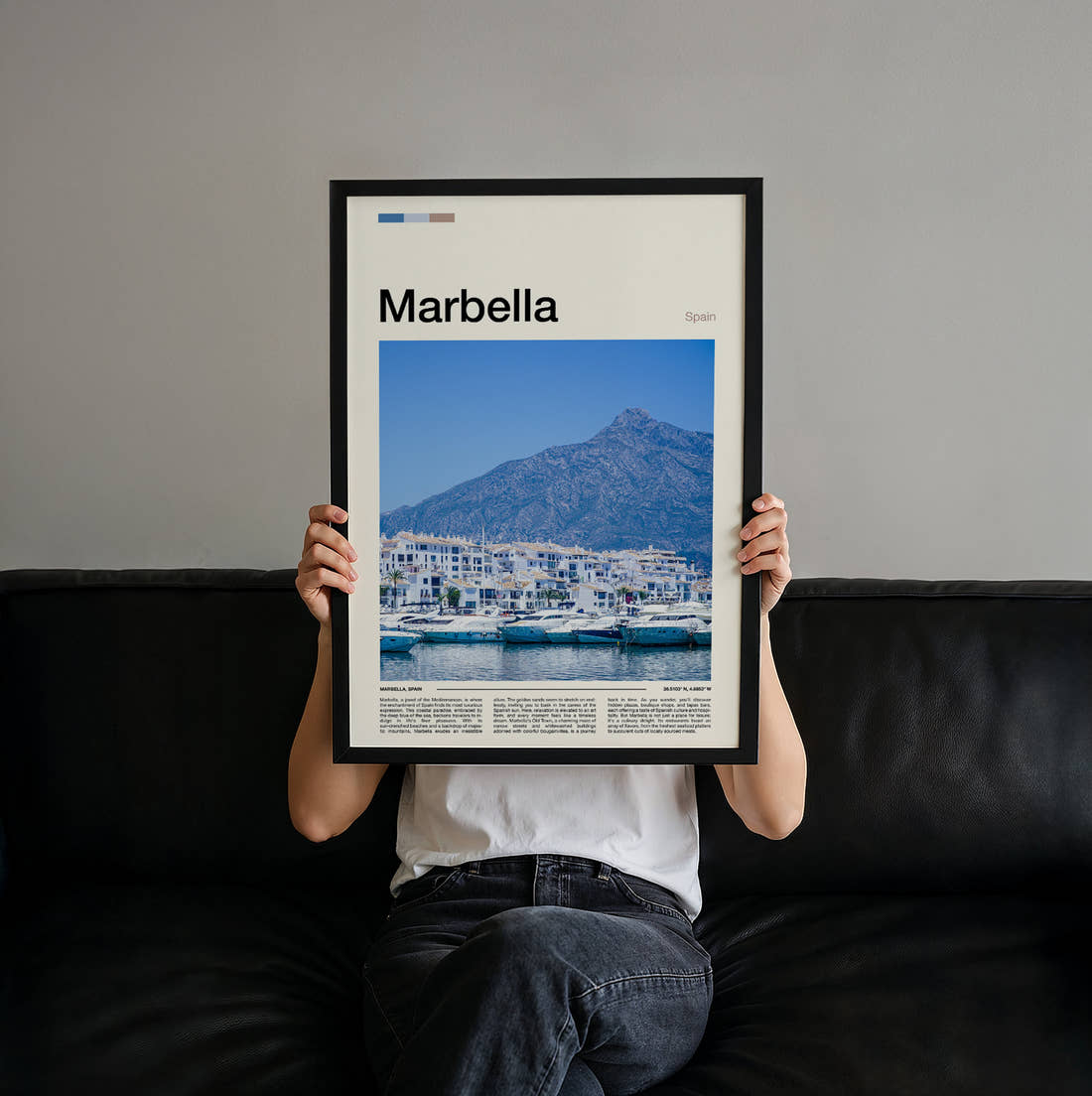 Marbella Marina Below The Mountain Travel Print held up by hand to show the size of the print