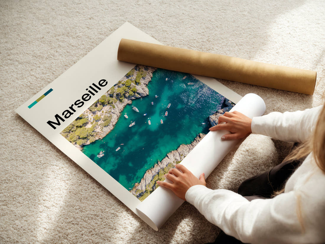 Marseille Rocky Cove From Above Travel Print being unrolled from its postal tube