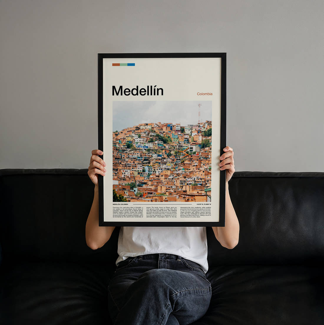 Medellín Colourful Hillside Houses Travel Print held up by hand to show the size of the print